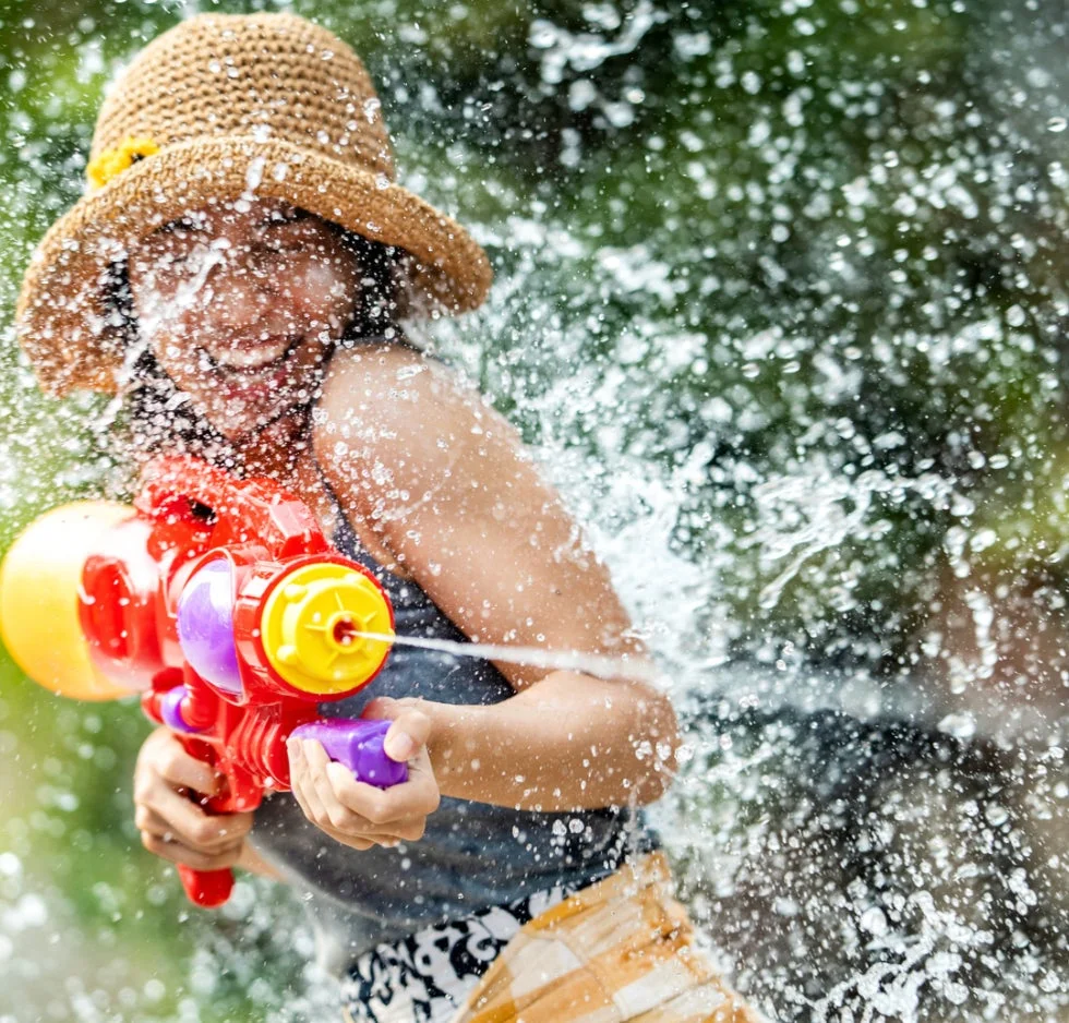 Children playing with water guns